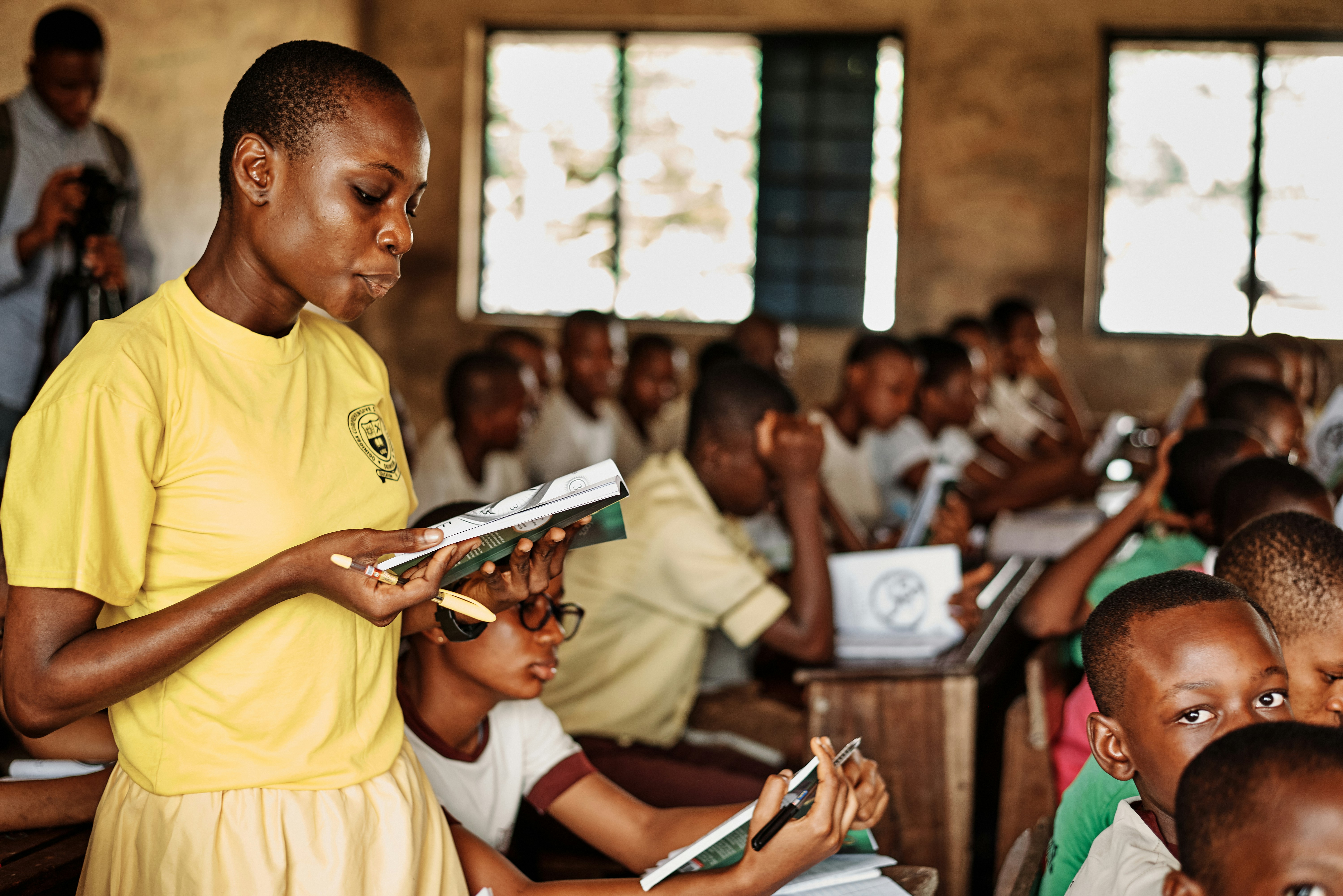 Student reading in a classroom